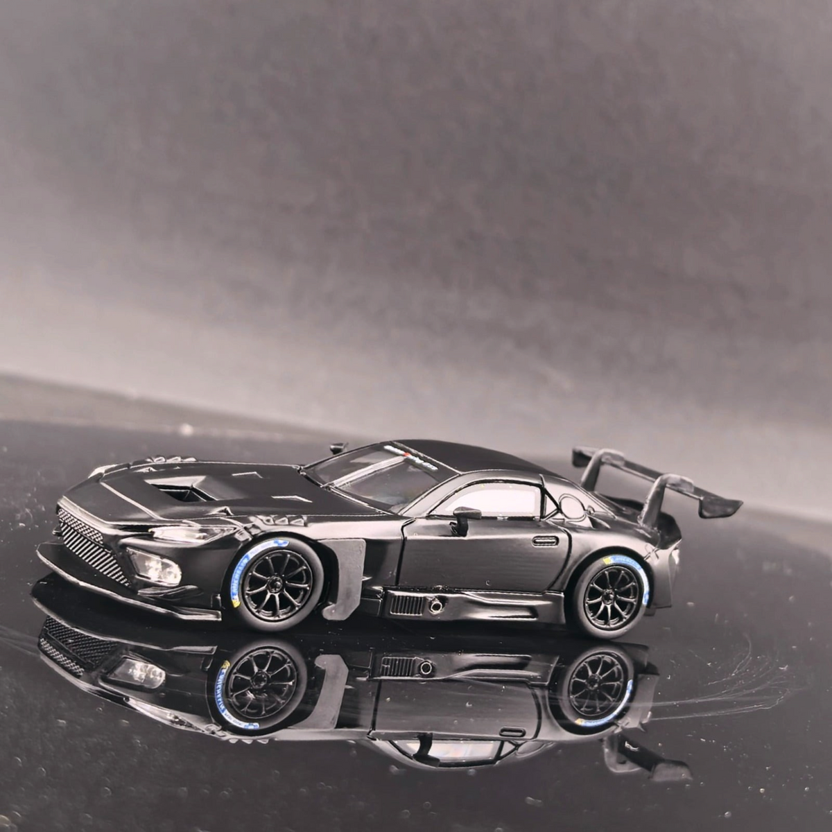 Lot57Supplies Diecast Shop 1:64 scale GT model Toyota GR GT3 diecast car in matte black with racing spoiler