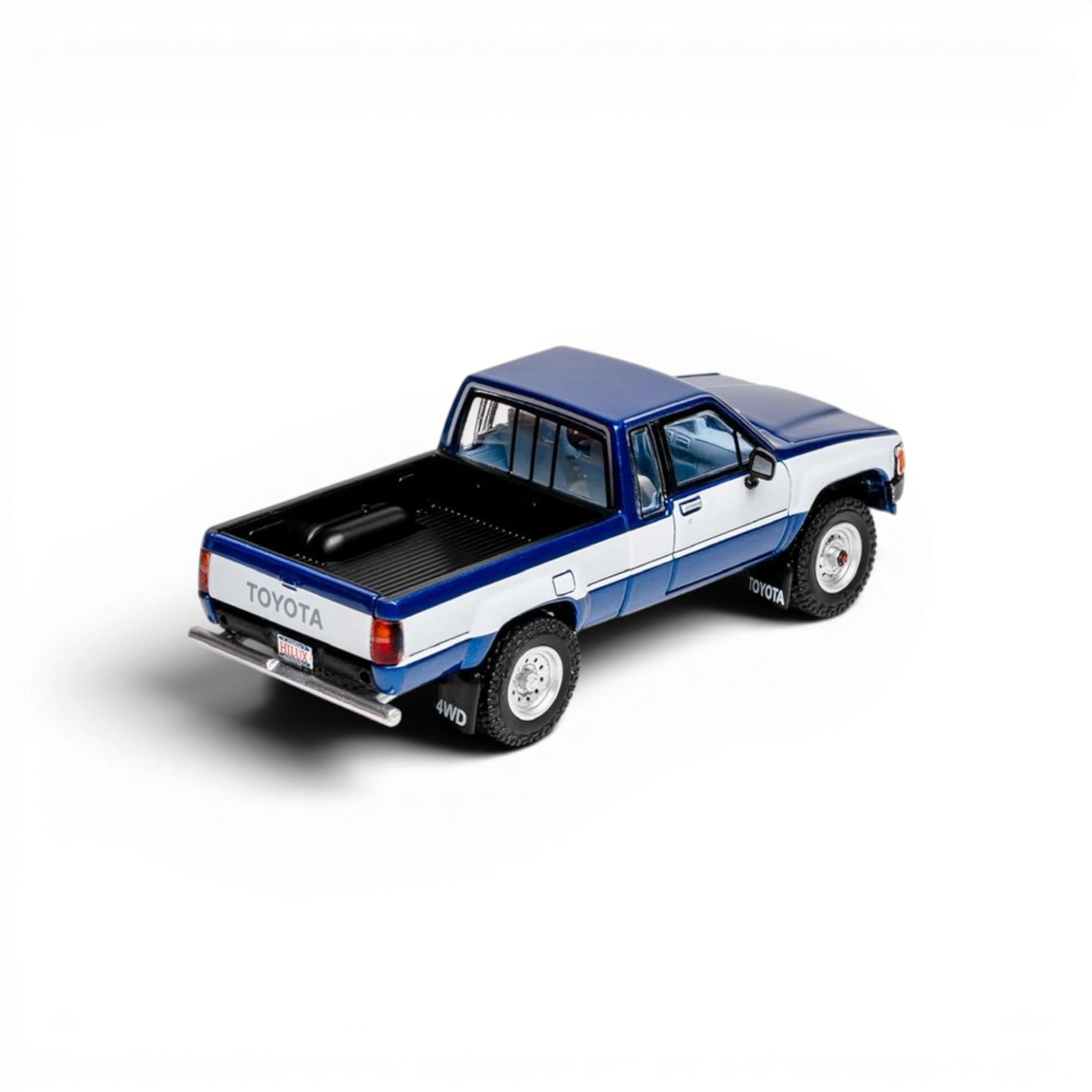 Lot57Supplies Diecast Shop 1:64 scale GCD Toyota Hilux Xtra Cab diecast model truck with blue and white decals