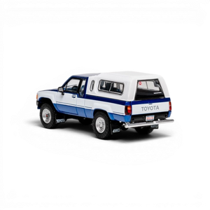 Lot57Supplies Diecast Shop 1:64 scale GCD Toyota Hilux Xtra Cab diecast model truck with blue decals and white canopy