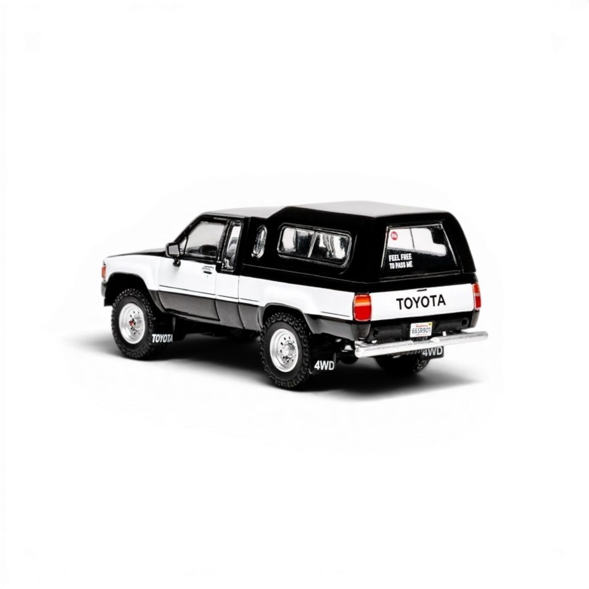 Lot57Supplies Diecast Shop 1:64 scale GCD Toyota Hilux Xtra Cab diecast truck with black decals and camper shell