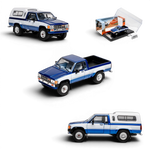 Lot57Supplies Diecast Shop 1:64 scale GCD Toyota Hilux Xtra Cab diecast model in blue and white with camper shell.