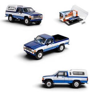 Lot57Supplies Diecast Shop 1:64 scale GCD Toyota Hilux Xtra Cab diecast model in blue and white with camper shell.