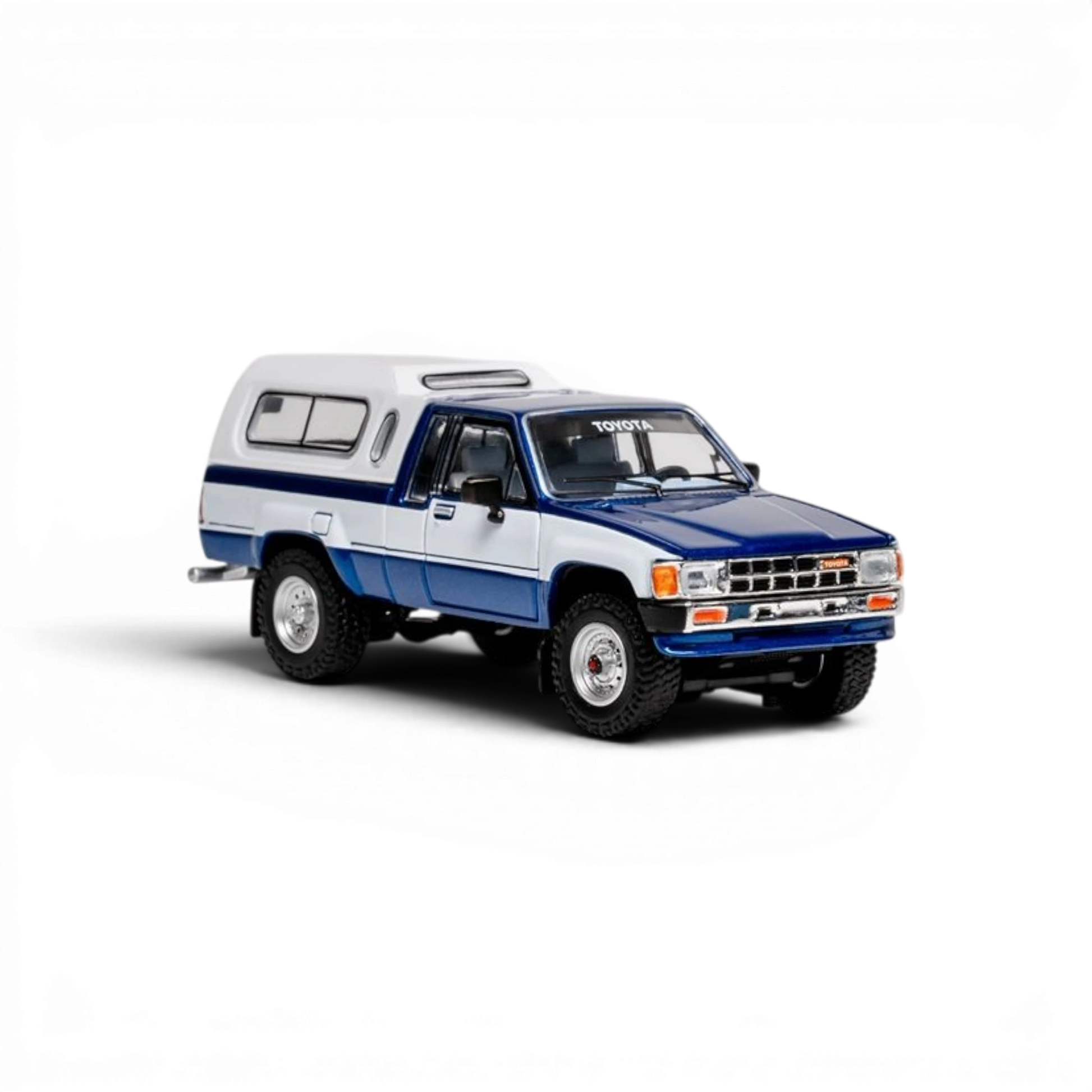 Lot57Supplies Diecast Shop 1:64 scale GCD Toyota Hilux Xtra Cab diecast model truck with blue and white decals
