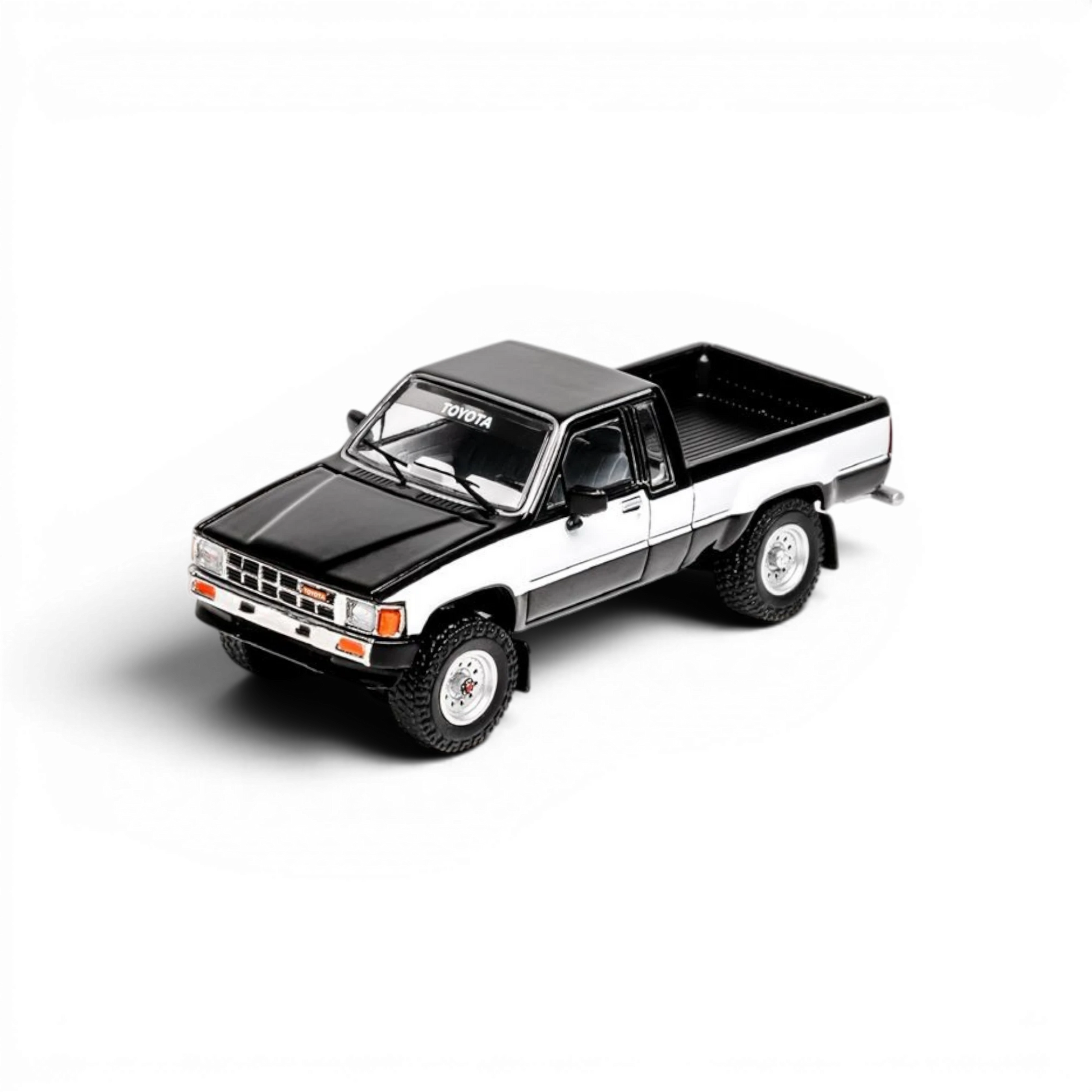 Lot57Supplies Diecast Shop 1:64 scale GCD Toyota Hilux Xtra Cab diecast model truck in black and white