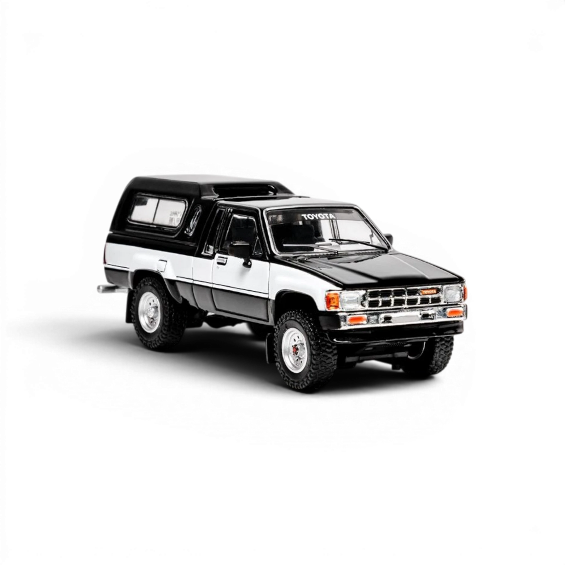 Lot57Supplies Diecast Shop 1:64 scale GCD Toyota Hilux Xtra Cab diecast model truck in black and white with decals