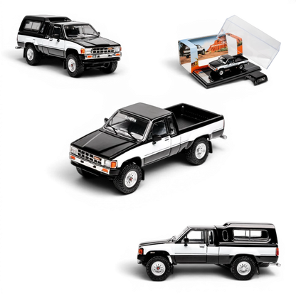 Lot57Supplies Diecast Shop 1:64 scale GCD Toyota Hilux Xtra Cab diecast model truck in black and white with camper shell.