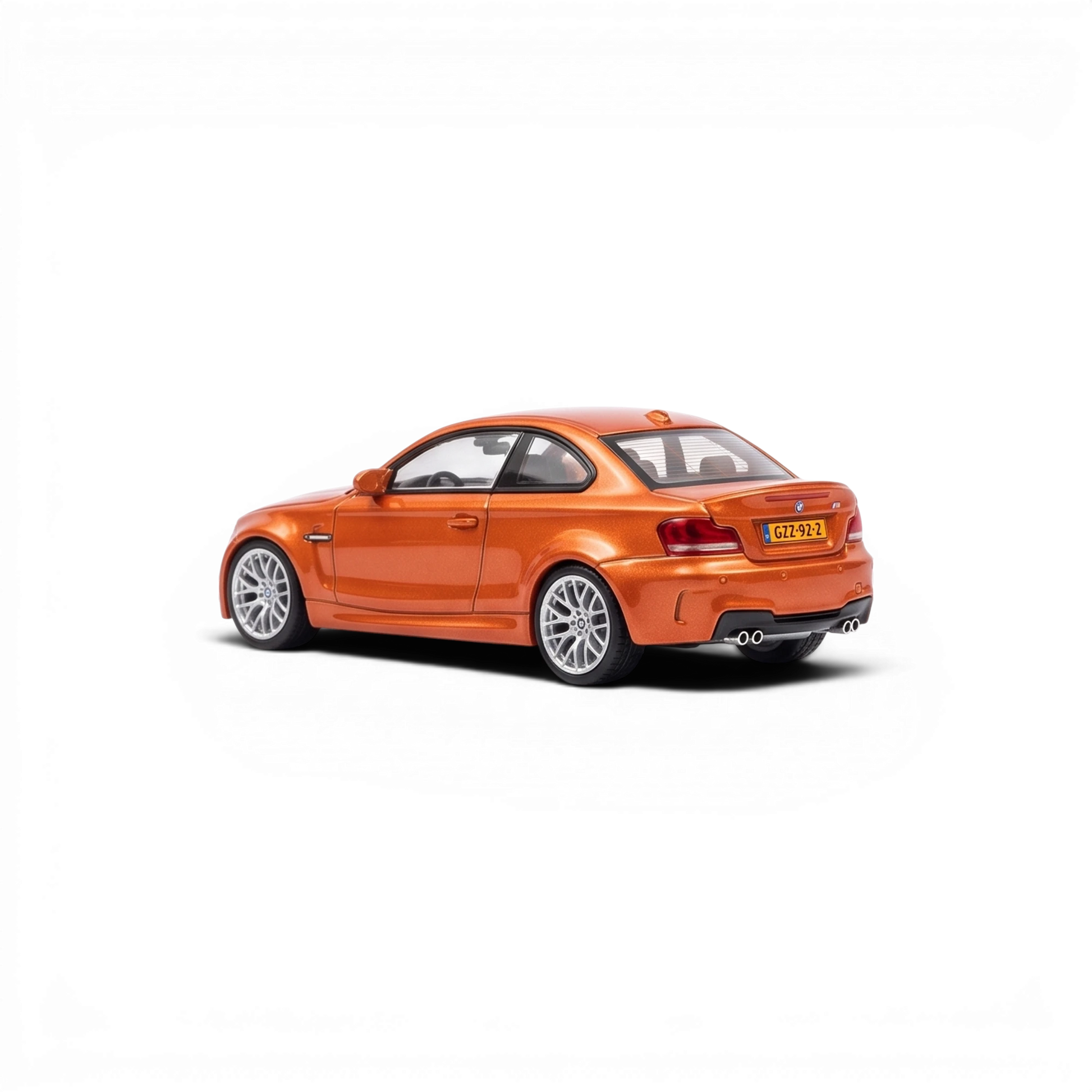 Lot57Supplies Diecast Shop MORTAL 1:64 scale Valencia Orange BMW 1M Coupe diecast model car, rear three-quarter view.