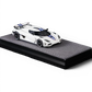 Lot57Supplies Diecast Shop VMB Agera R 1:64 scale white diecast model car with blue racing stripes on a grey display base.