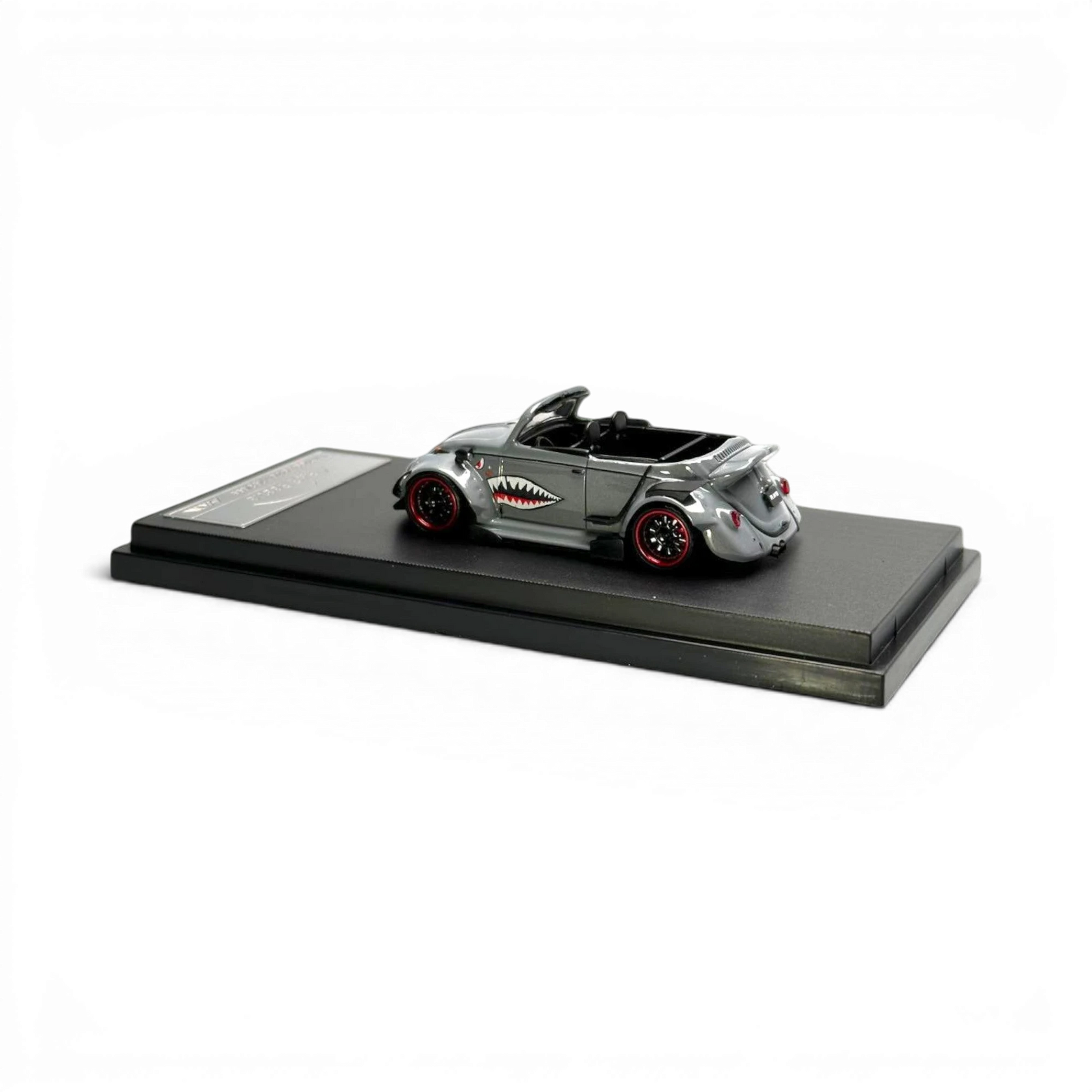 Lot57Supplies Diecast Shop grey 1:64 scale HKM Model VW Beetle Convertible with shark mouth graphic and red rims.