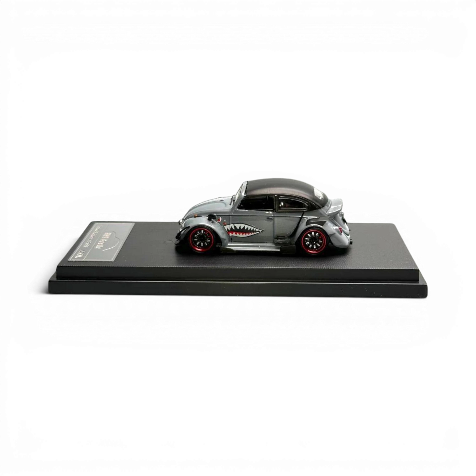 Lot57Supplies Diecast Shop grey 1:64 scale HKM Model VW Beetle Convertible with shark mouth graphic and red rims.