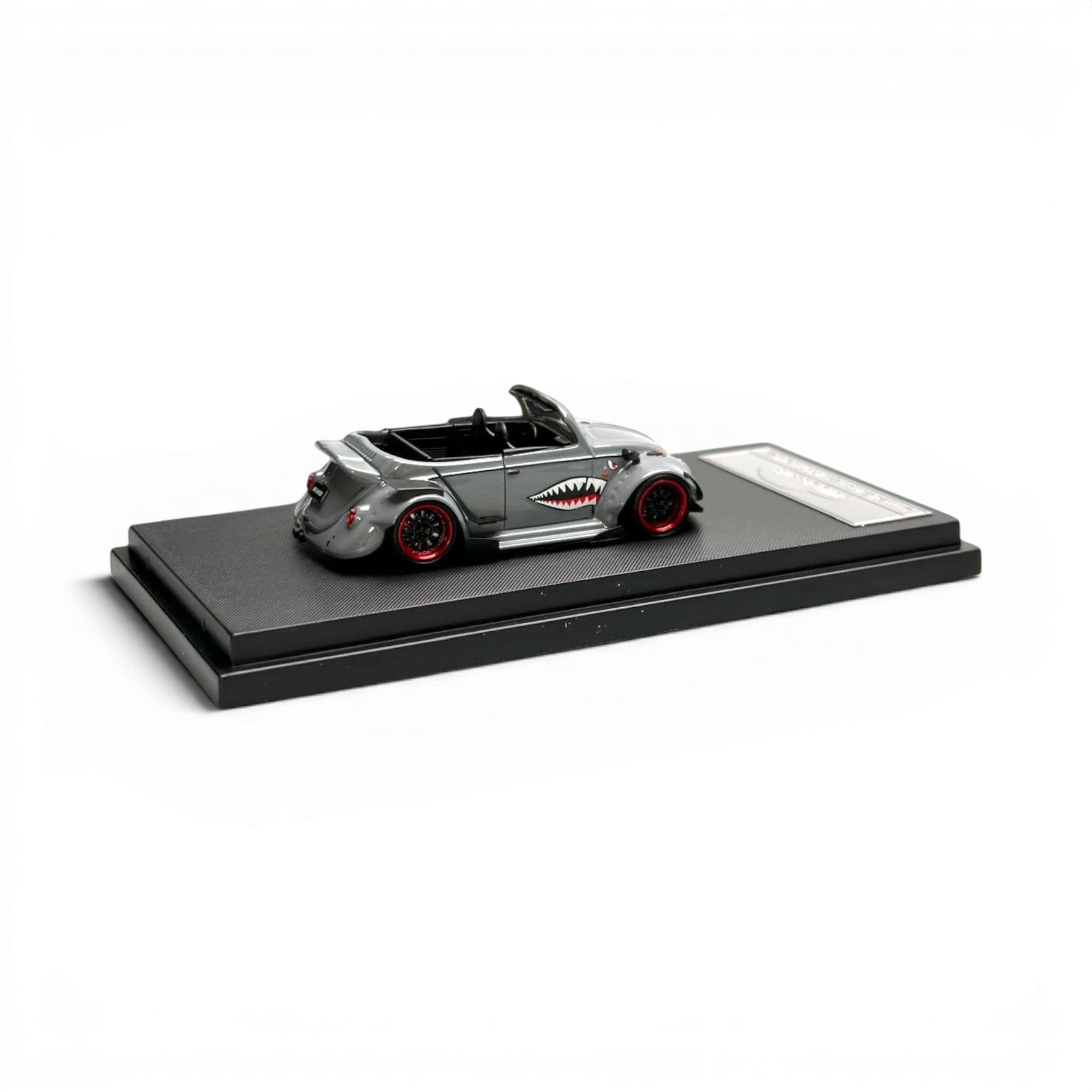 Lot57Supplies Diecast Shop grey 1:64 scale VW Beetle convertible model with shark mouth graphic and red rims.