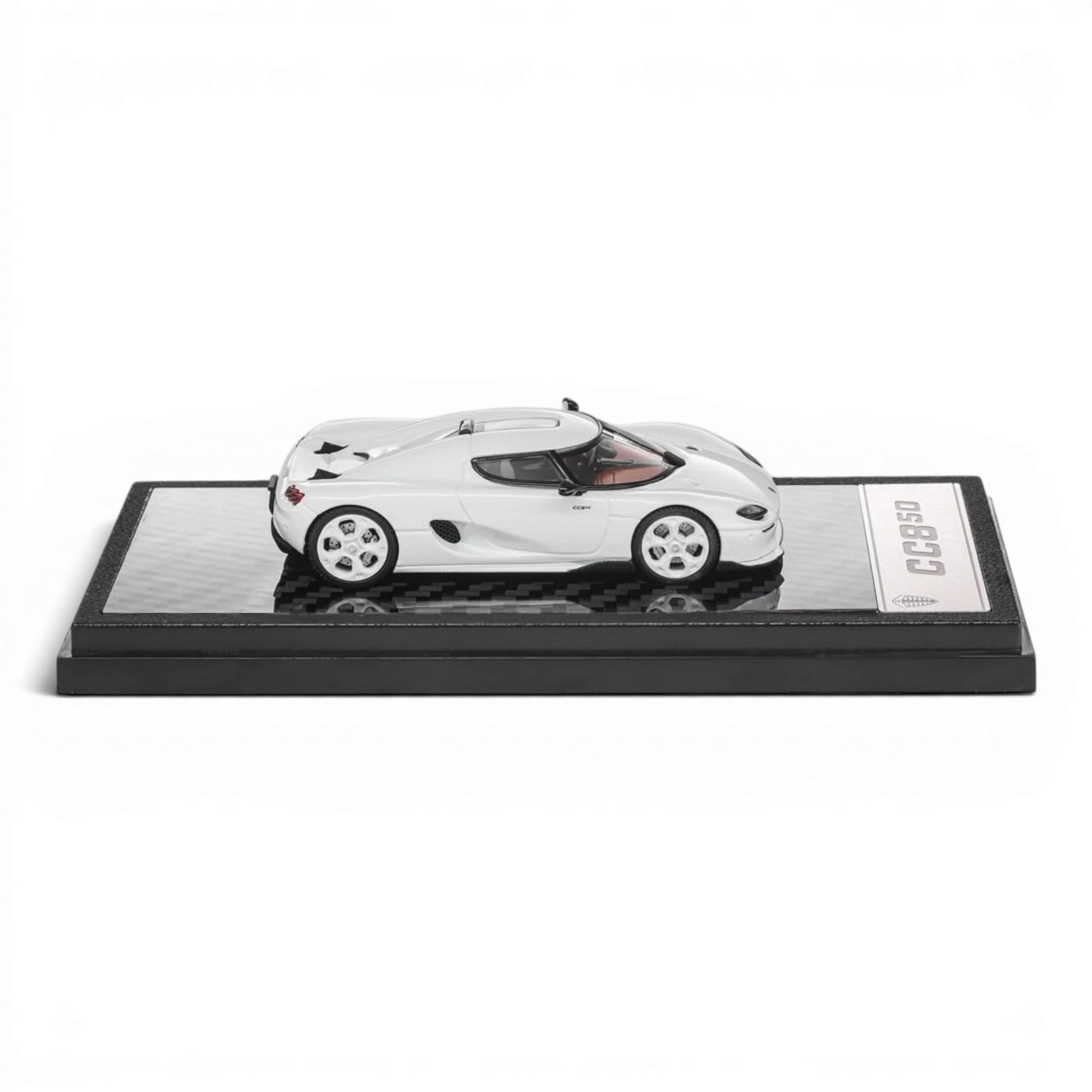 Lot57Supplies Diecast Shop 1:64 scale white LCD Koenigsegg CC850 diecast model car on a display base