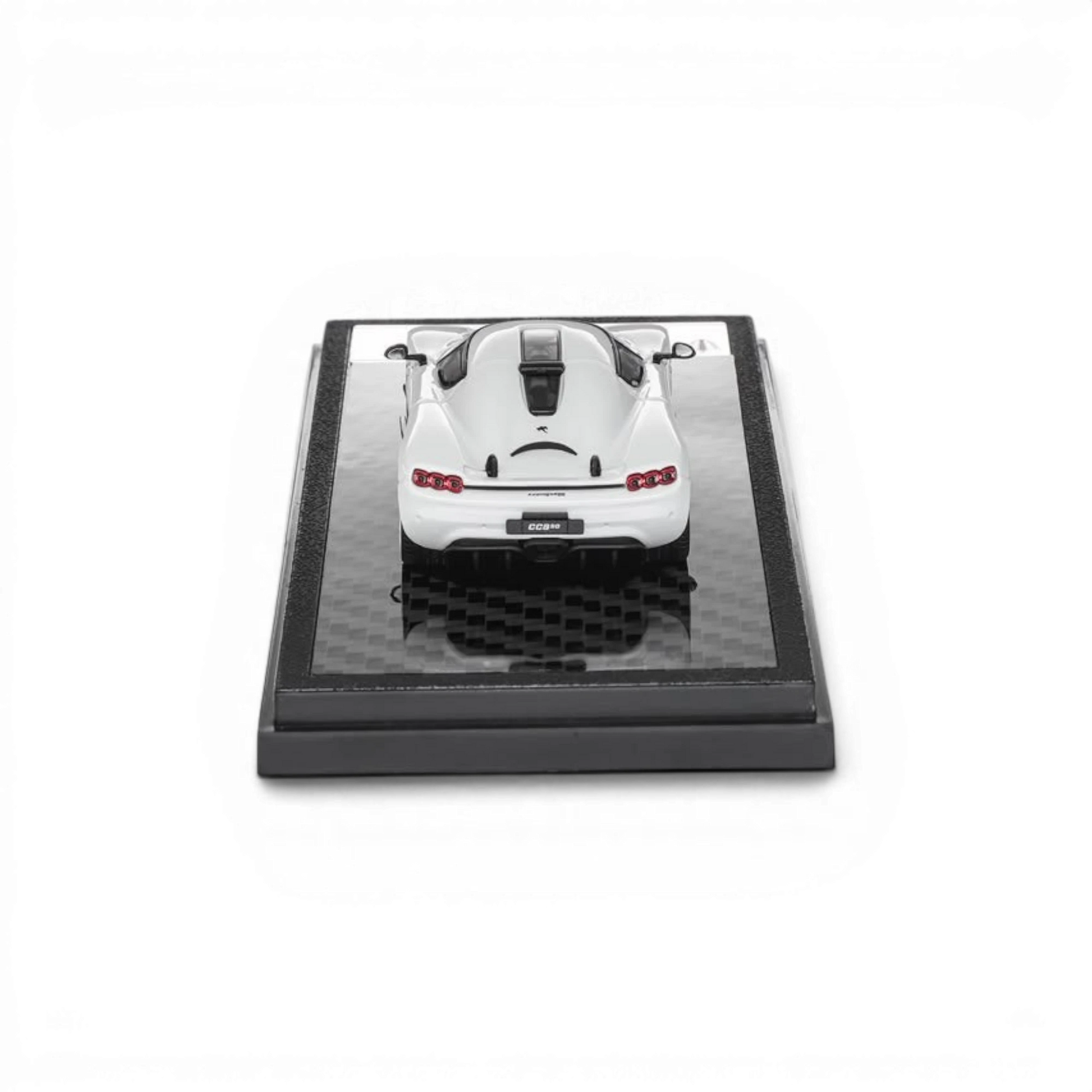 Lot57Supplies Diecast Shop 1:64 scale white LCD Koenigsegg CC850 diecast model car on a carbon fiber display base