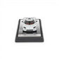 Lot57Supplies Diecast Shop 1:64 scale white LCD Koenigsegg CC850 diecast model car on a carbon fiber display base.