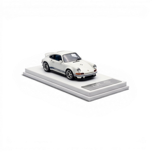 Lot57Supplies Diecast Shop white and dark blue 1:64 scale resin model of a Singer DLS car with blue racing stripes on a white display base.