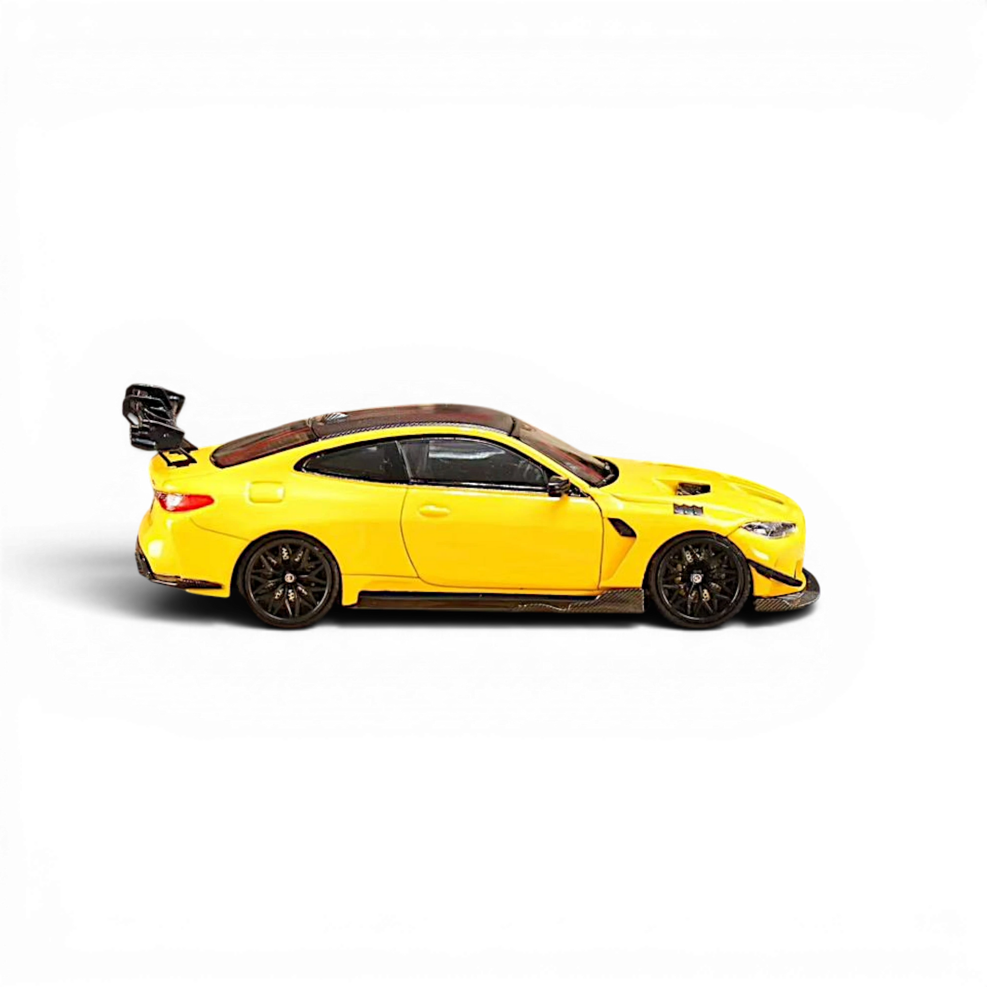 Lot57Supplies Diecast Shop yellow SW BMW M4 Flossmann G82 GTR diecast model car, 1:64 scale side view