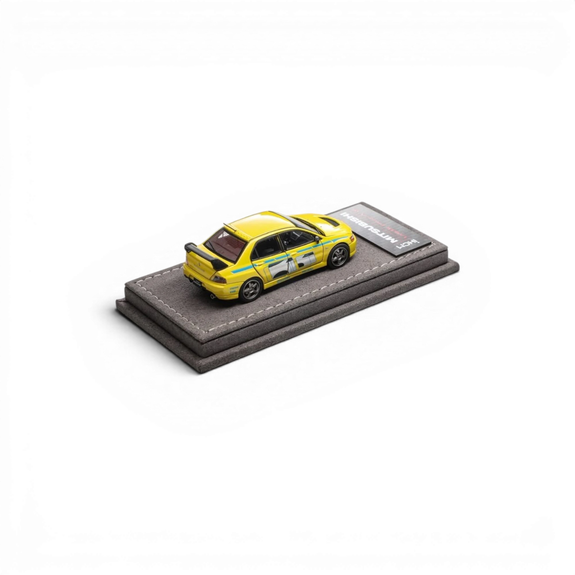 Lot57Supplies Diecast Shop yellow IHCM Mitsubishi Lancer Evolution IX GSR 1:64 scale diecast model car on display base