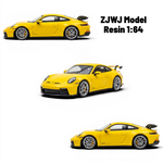 Lot57Supplies Diecast Shop yellow 1:64 scale resin Porsche 911 GT3 model with silver wheels and black spoiler.