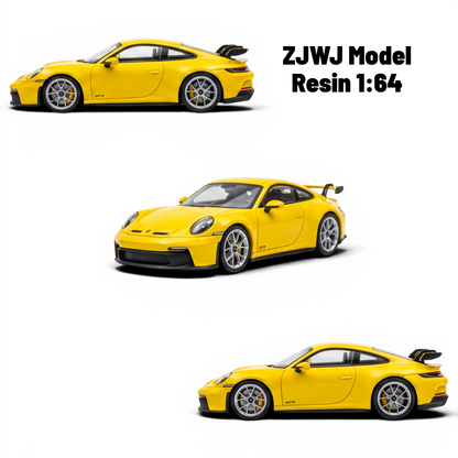 Lot57Supplies Diecast Shop yellow 1:64 scale resin Porsche 911 GT3 model with silver wheels and black spoiler.