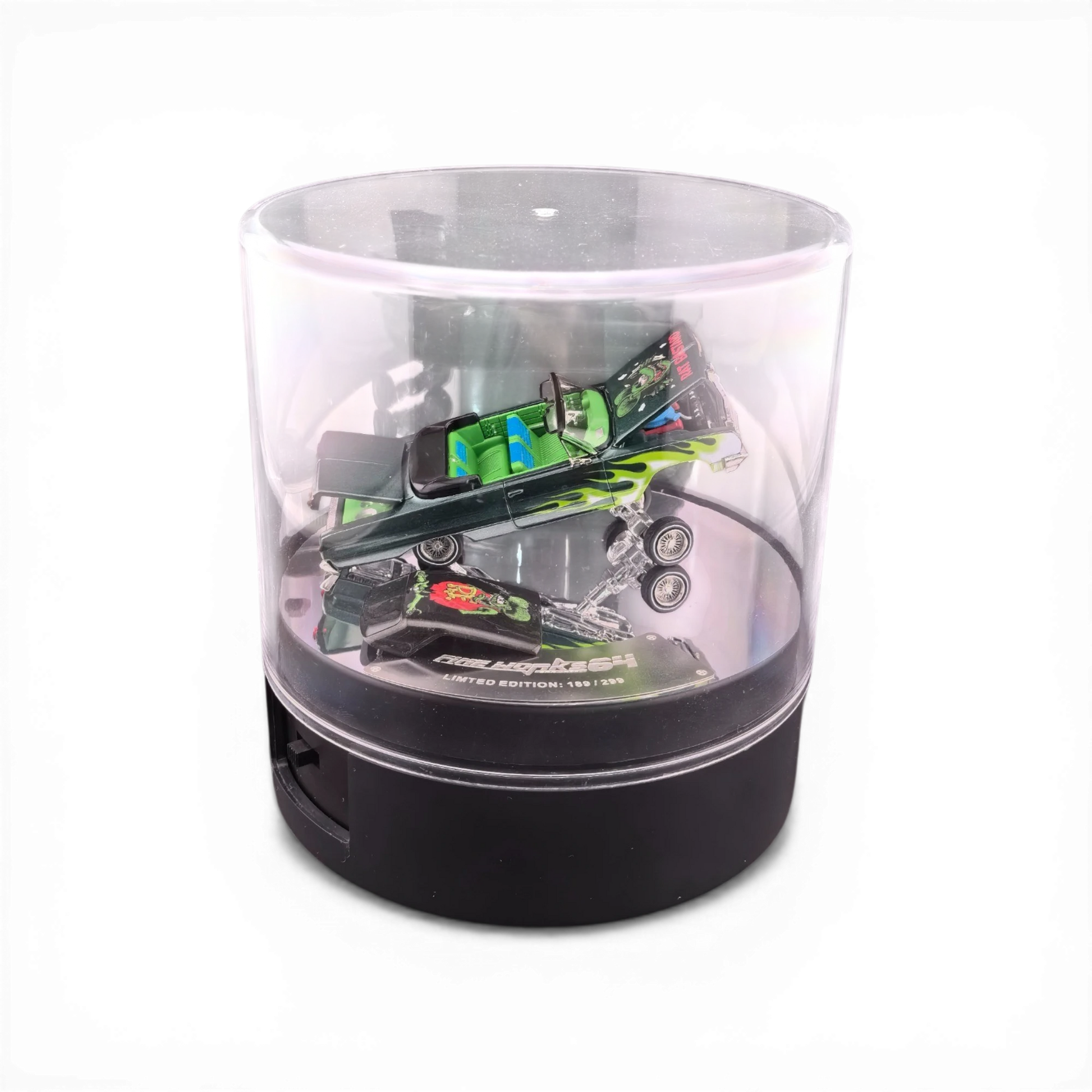 Lot57Supplies Diecast Shop 1:64 emerald green Chevrolet Impala West Coast Bouncing Car with flame graphics and opening parts.