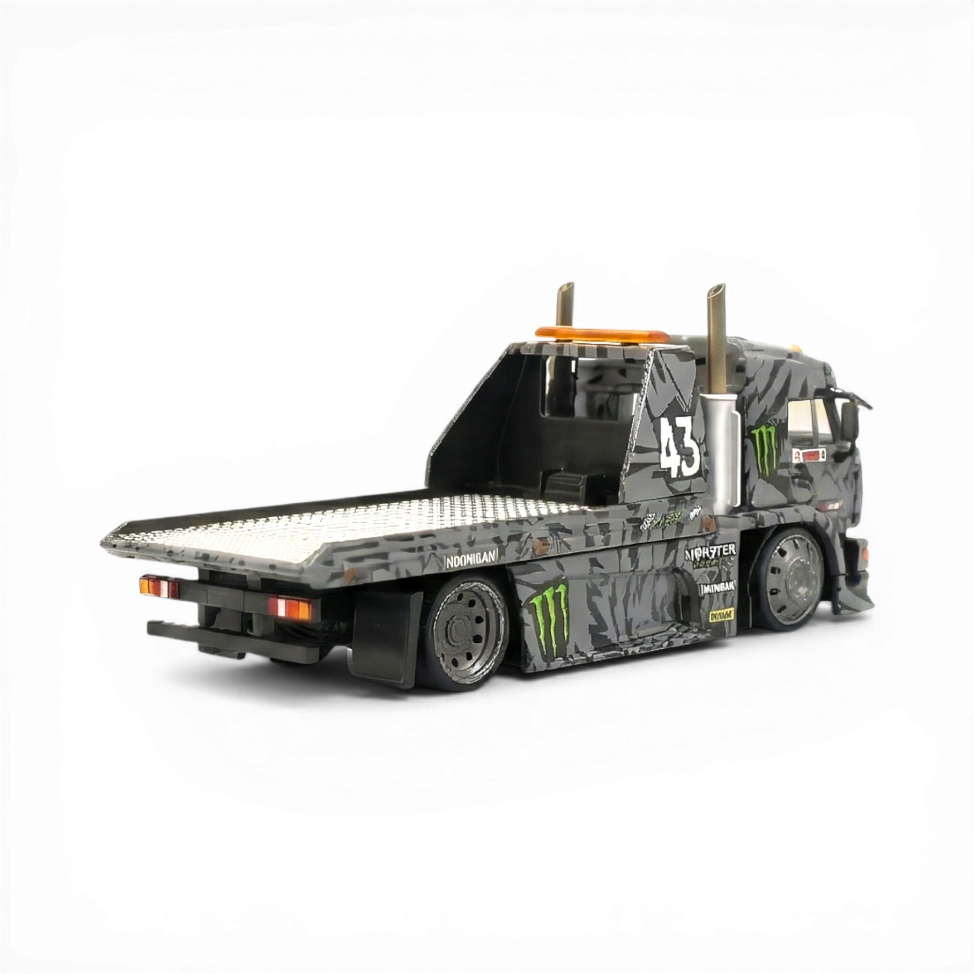 Lot57Supplies Diecast Shop: 1:64 scale grey diecast KamaZ tow truck with Monster Energy livery, flatbed, and number 43.