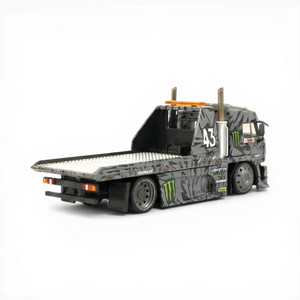 Lot57Supplies Diecast Shop: 1:64 scale grey diecast KamaZ tow truck with Monster Energy livery, flatbed, and number 43.