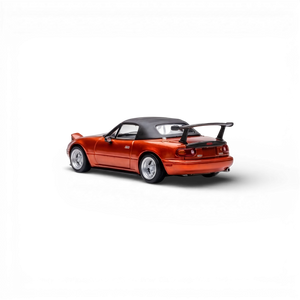 Lot57Supplies diecast model of a red Mazda Miata MX-5 with a black soft top and spoiler. 1:64 scale.