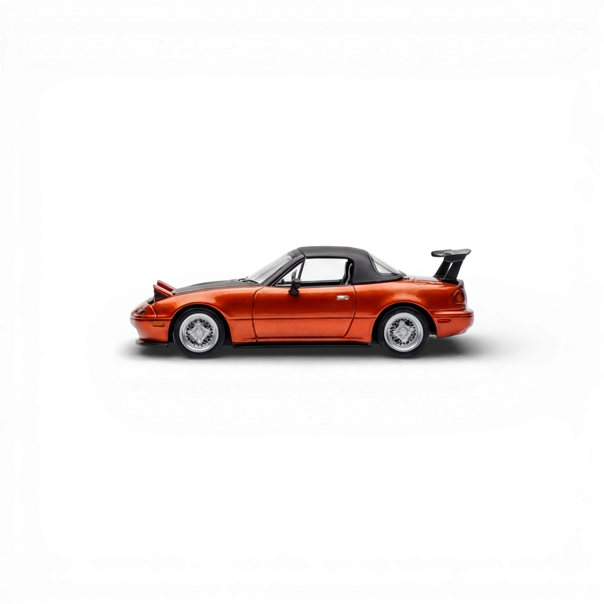 Lot57Supplies Diecast Shop orange Mazda Miata MX-5 HEC2023 Edition 1:64 scale model with pop-up headlights and spoiler.