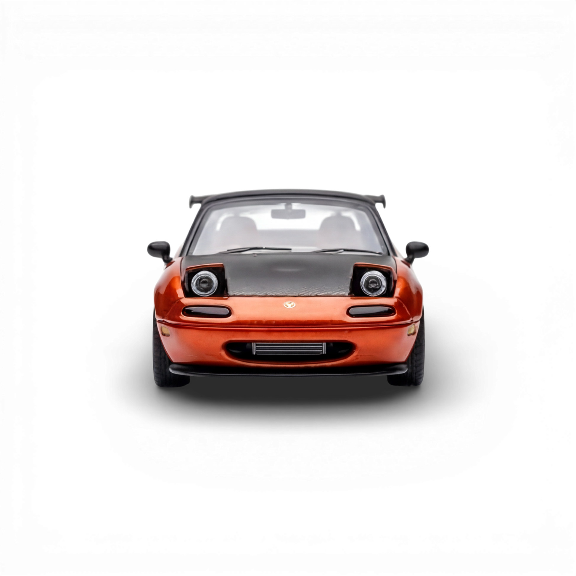 Lot57Supplies Diecast Shop: Orange 1:64 scale Microturbo Mazda Miata MX-5 HEC2023 Edition diecast model with pop-up headlights and black hood.