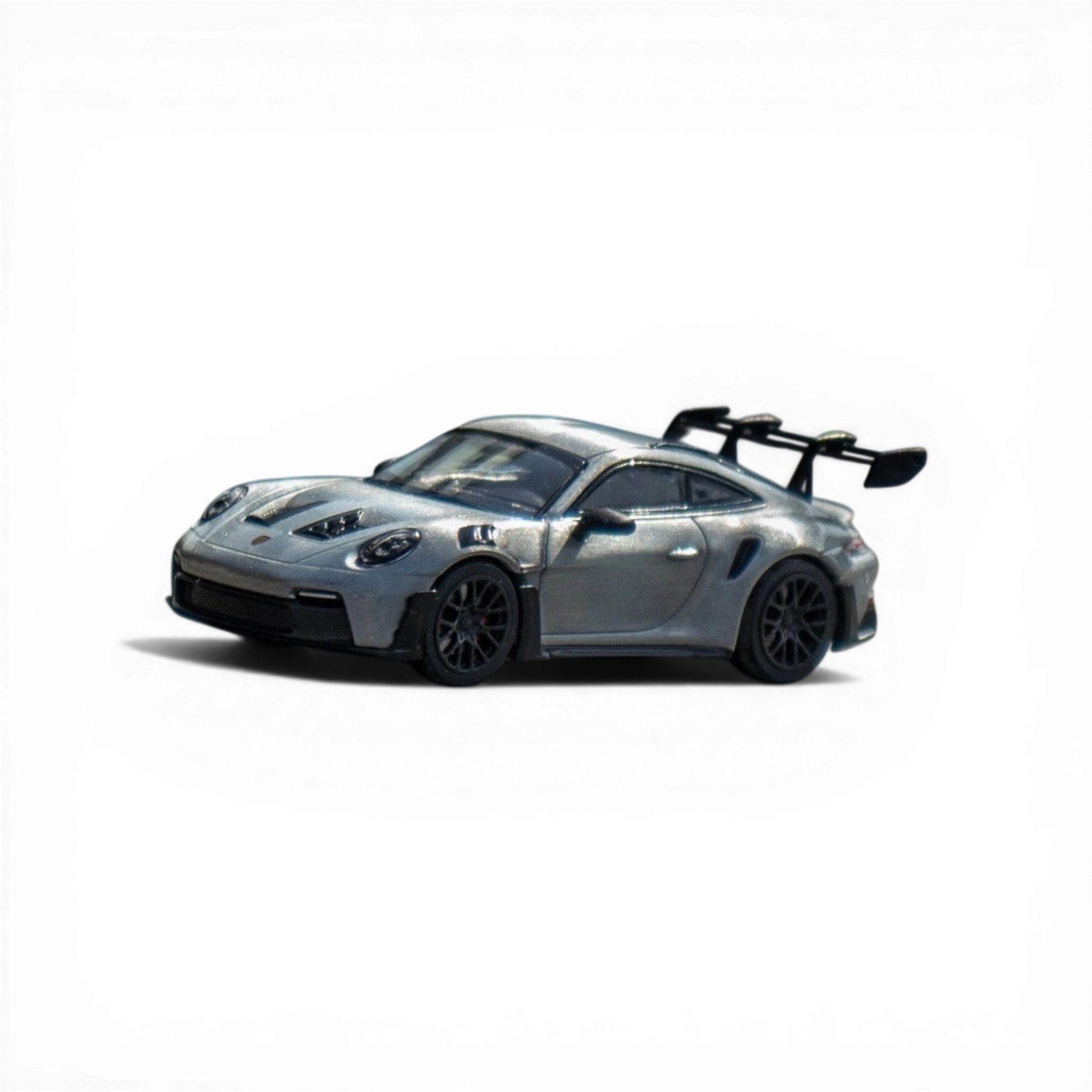 Lot57Supplies Diecast Shop Minichamps Porsche 911 GT3 RS raw silver 1:64 scale diecast model with large rear spoiler.