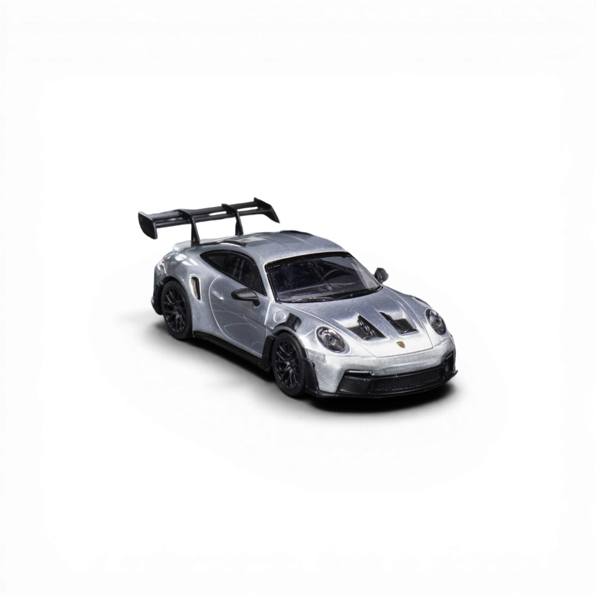Lot57Supplies Diecast Shop Minichamps Porsche 911 GT3 RS 1:64 scale raw silver diecast model with large rear spoiler.