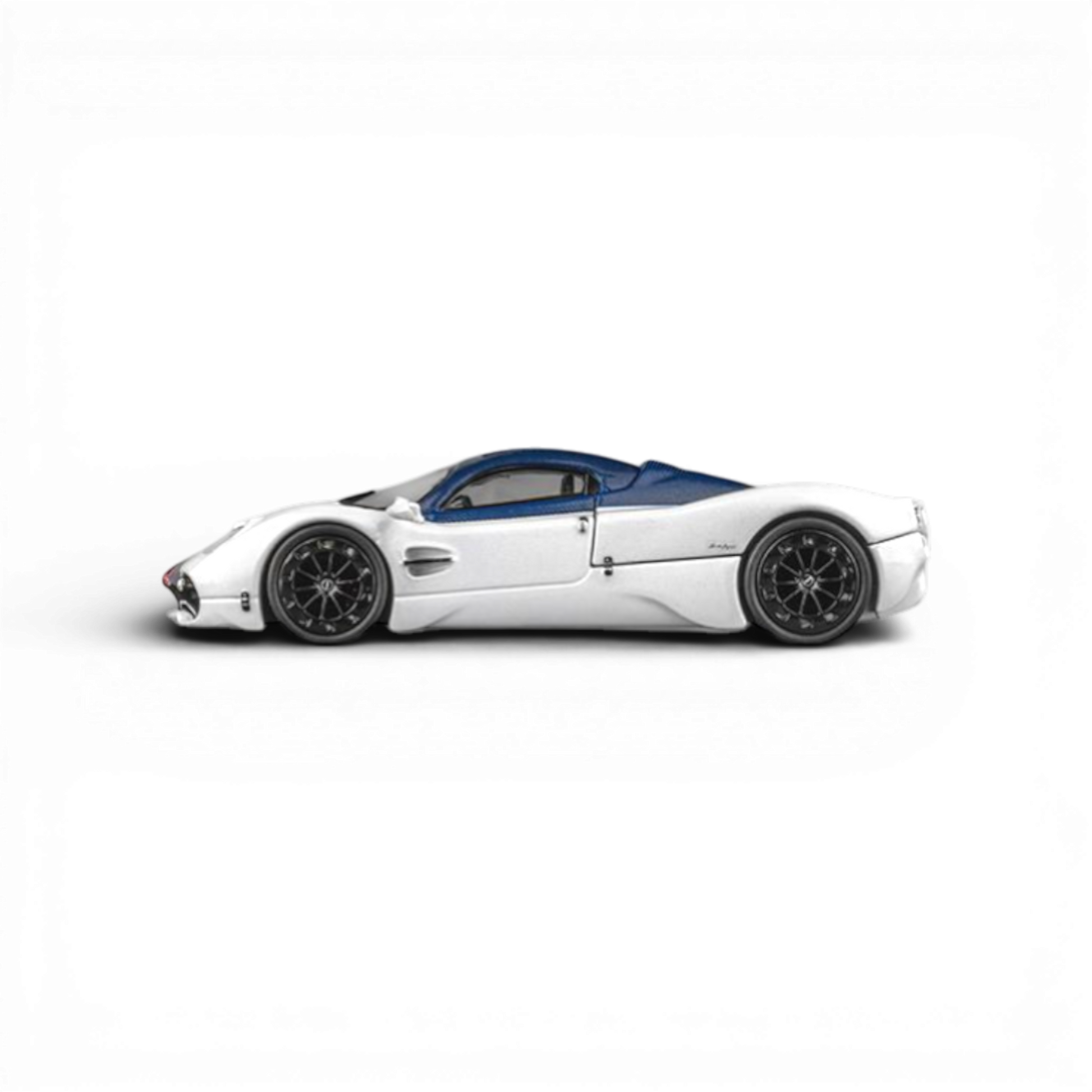 Lot57Supplies Diecast Shop 1:64 scale white Pagani Utopia model with blue carbon fiber roof and black wheels.