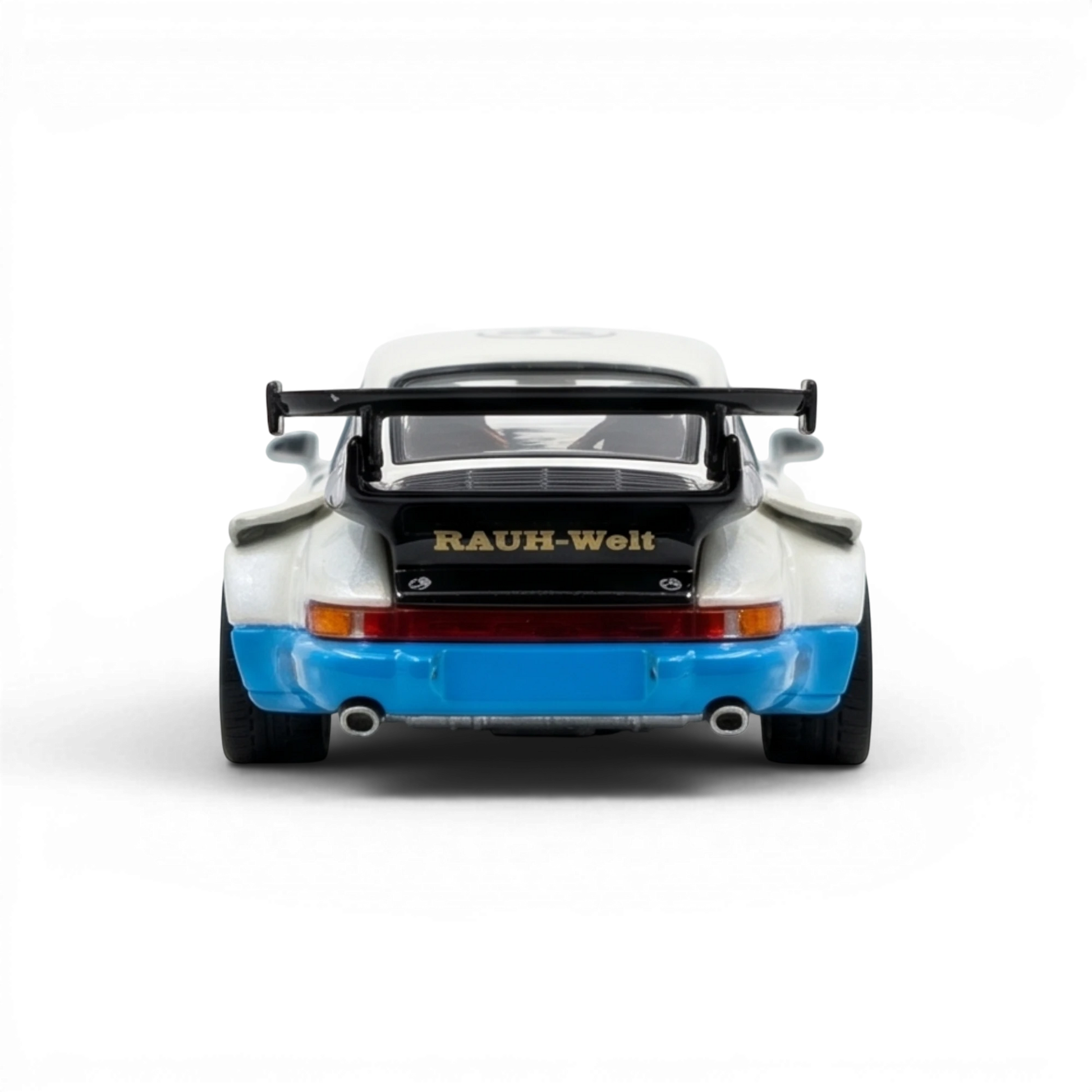 Lot57Supplies Diecast Shop 1:64 scale matte white PGM RWB 930 model car with black spoiler and blue accents.