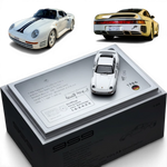 Lot57Supplies Diecast Shop: White 1:64 scale resin model of a Porsche 959 with dark blue stripes, presented on a display base.