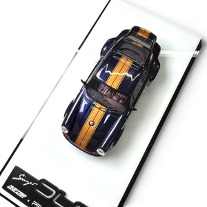 Lot57Supplies Diecast Shop 1:64 scale dark blue resin Porsche Singer DLS model with gold stripes and roof detail.