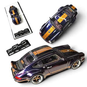Lot57Supplies Diecast Shop 1:64 scale dark blue resin Porsche Singer DLS model car with gold stripes and a rear spoiler.