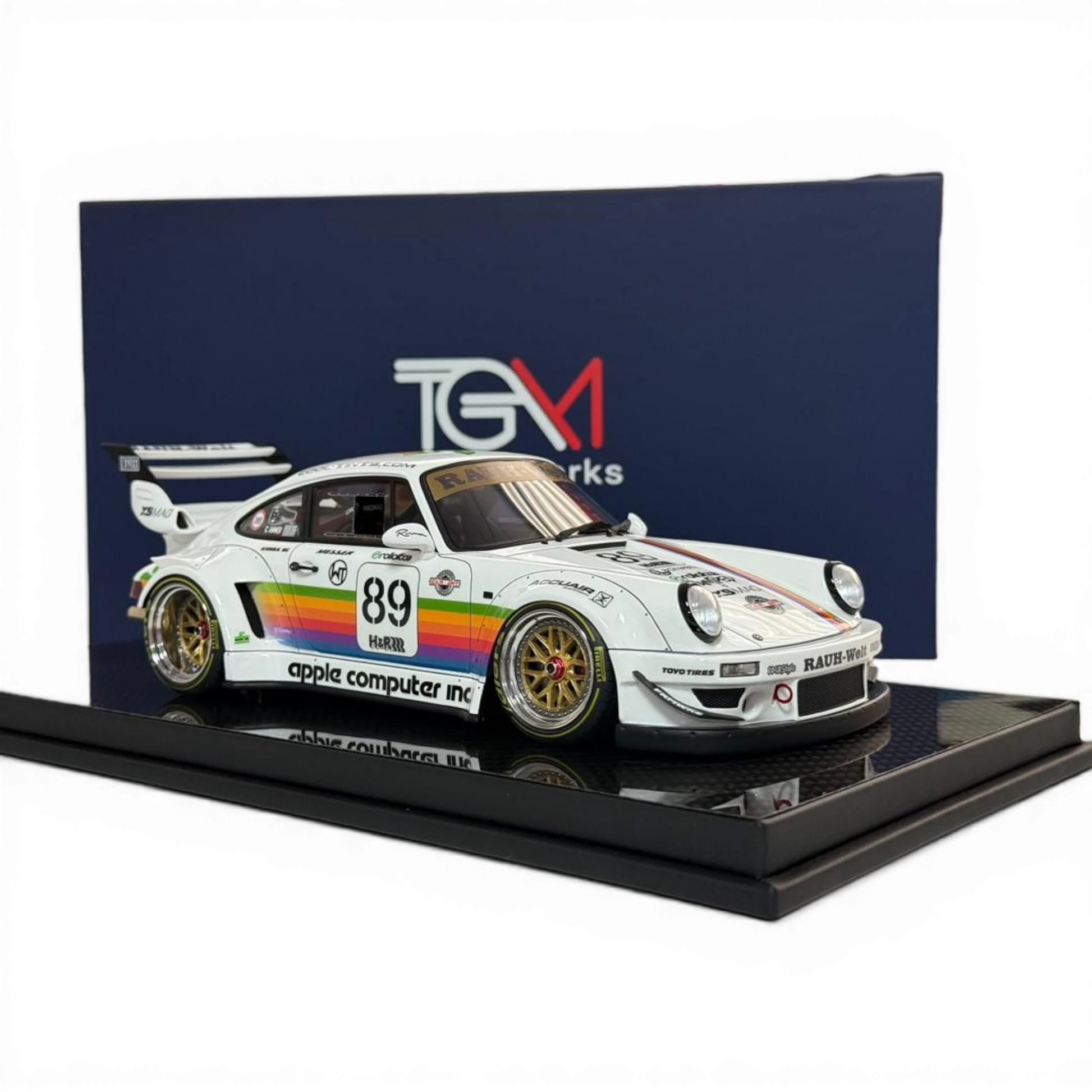 Lot57Supplies Diecast Shop 1:18 scale TGM Porsche RWB 964 model car in white with Apple Computer livery, rainbow stripe, #89, and gold BBS wheels.