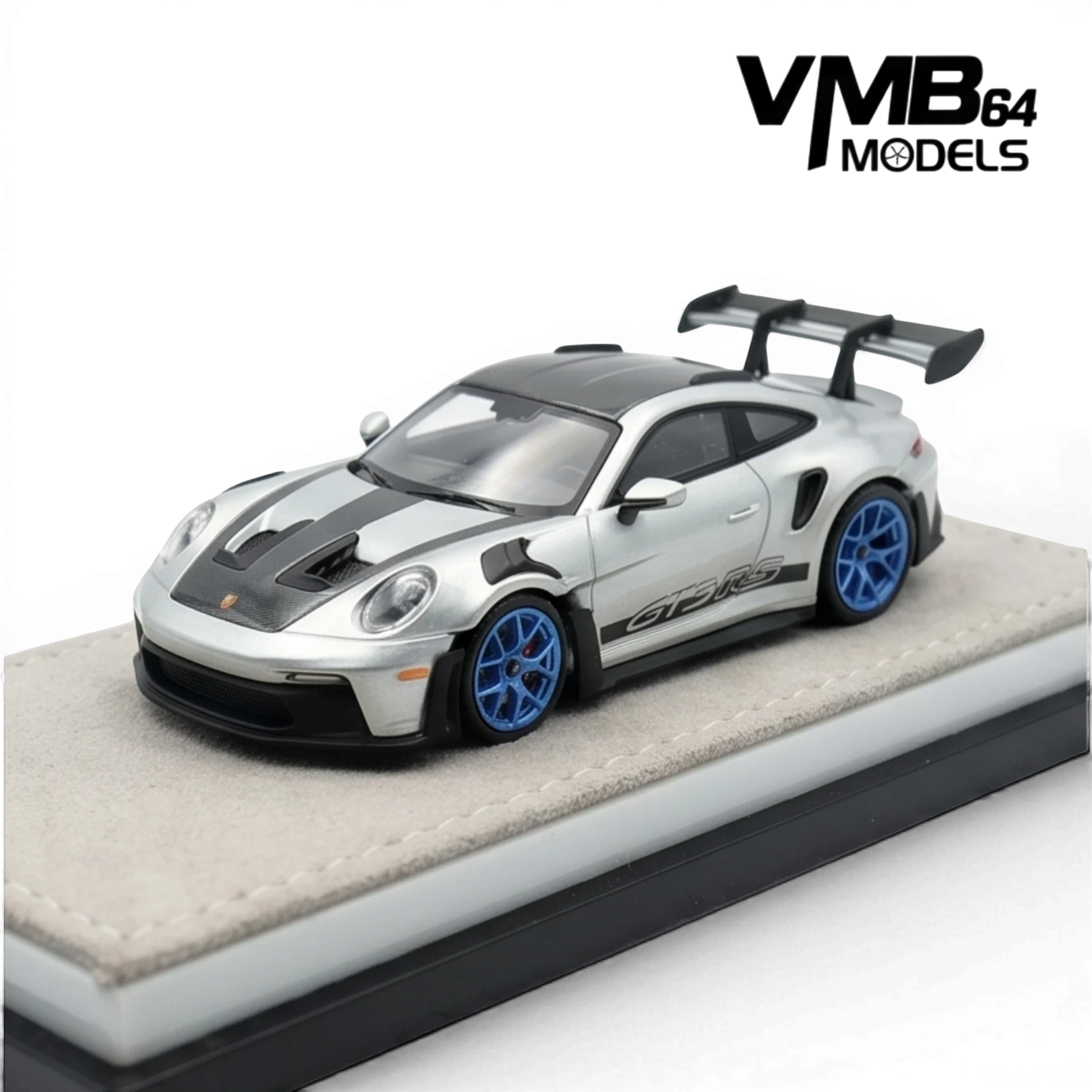 Lot57Supplies Diecast Shop VMB 992 GT3 RS 1:64 scale model in metallic silver with black racing stripes and blue wheels.