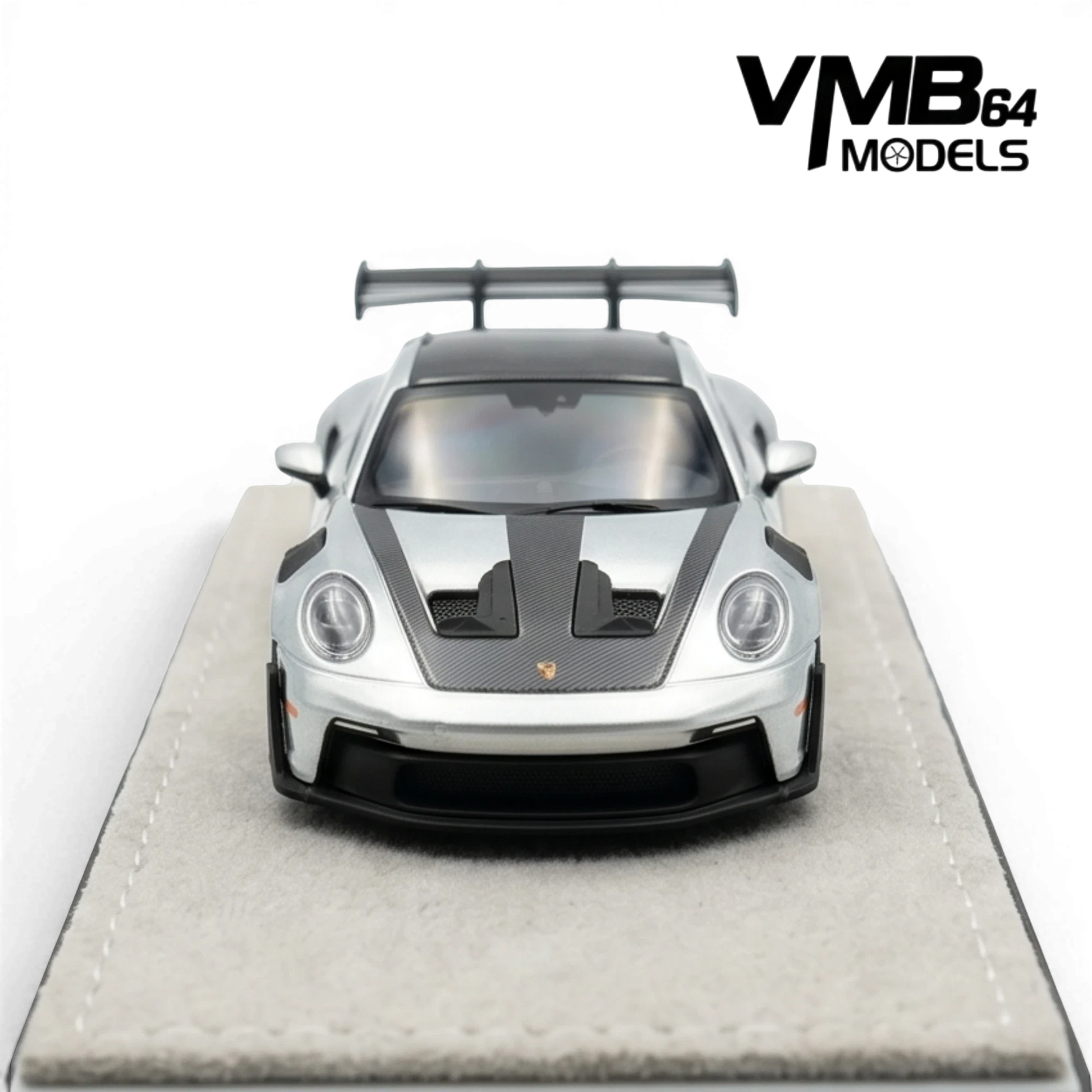 Lot57Supplies Diecast Shop: Metallic silver 1:64 scale VMB 992 GT3 RS model car with carbon fiber accents and large rear wing.