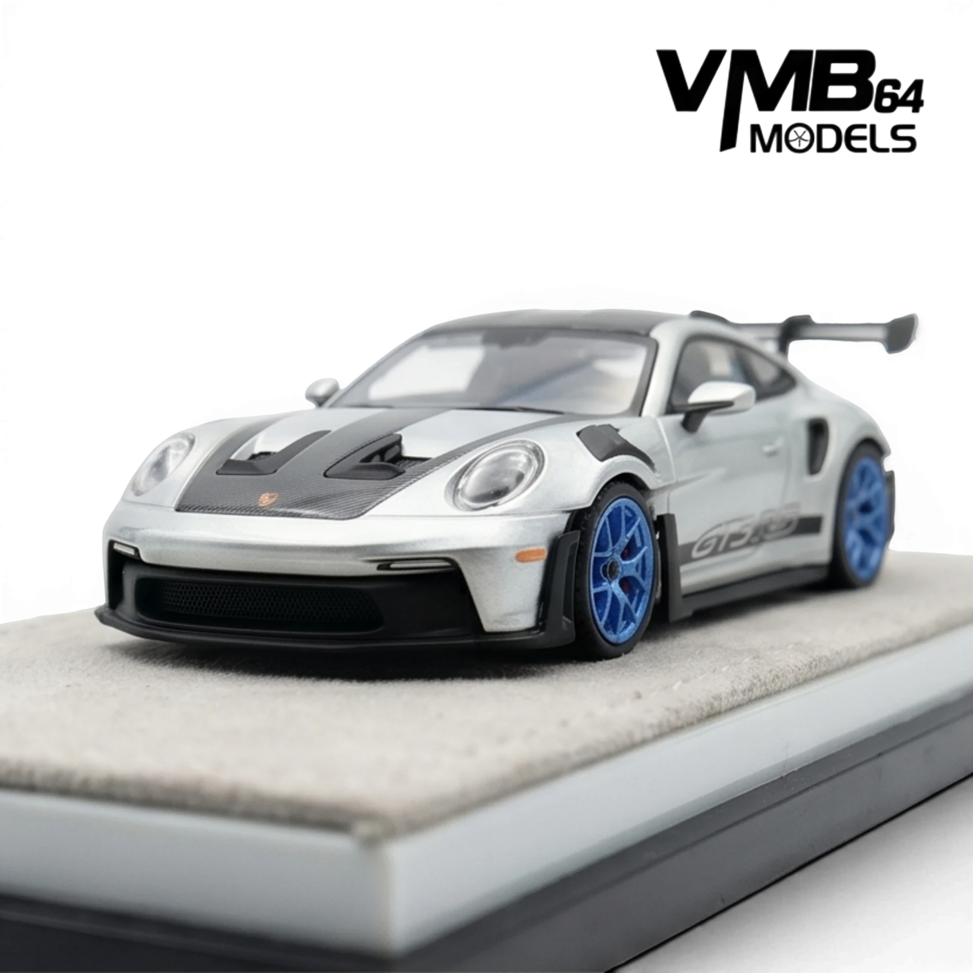 Lot57Supplies Diecast Shop VMB 992 GT3 RS 1:64 scale model in metallic silver with blue wheels and carbon fiber accents.