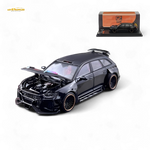 Model car with open hood on a white background, featuring a display case in the background.