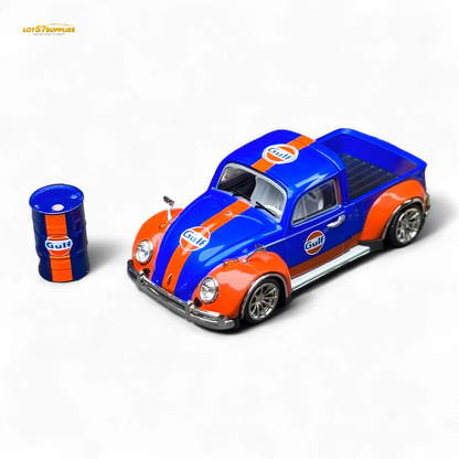 Model car with Gulf livery next to a small oil drum on a white background