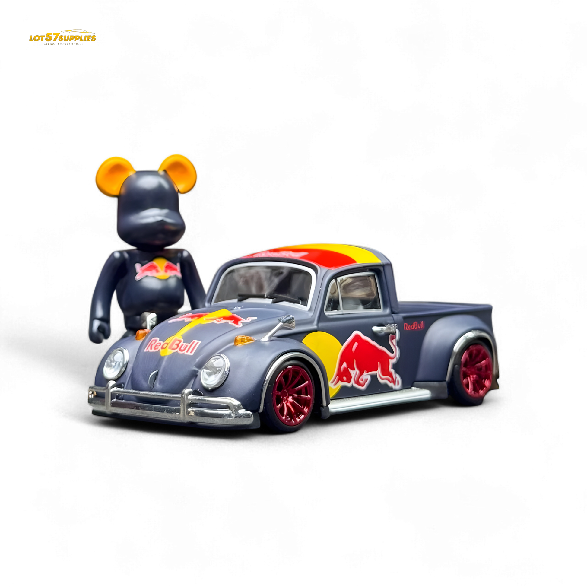Toy figure of a bear with a Red Bull-themed toy truck on a white background